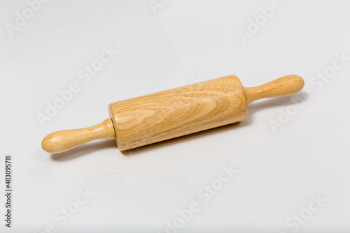 Wooden rolling pin isolated on white background. The dough rolling concept. Wooden kneading stick isolated on white background