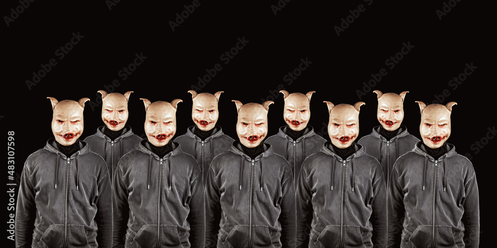 Group of anonymous persons wearing pig masks. Mysterious criminal,social media haters, internet activities concept. Copy space. Black background. Group of anonymous persons wearing pig masks. Mysterious criminal,social media haters, internet activities concept. Copy space. Black background.