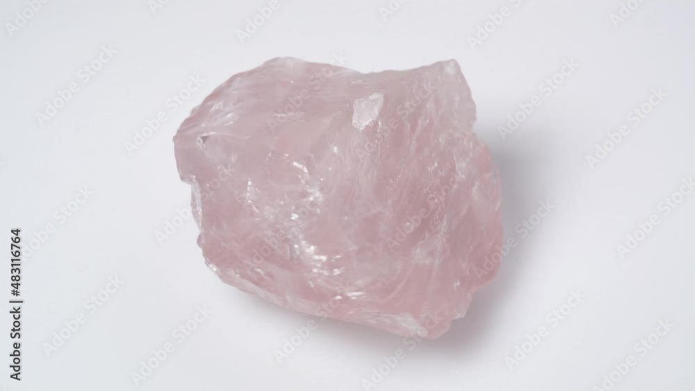 natural rose quartz gemstone on the white turning table natural rose quartz gemstone on the white turning table