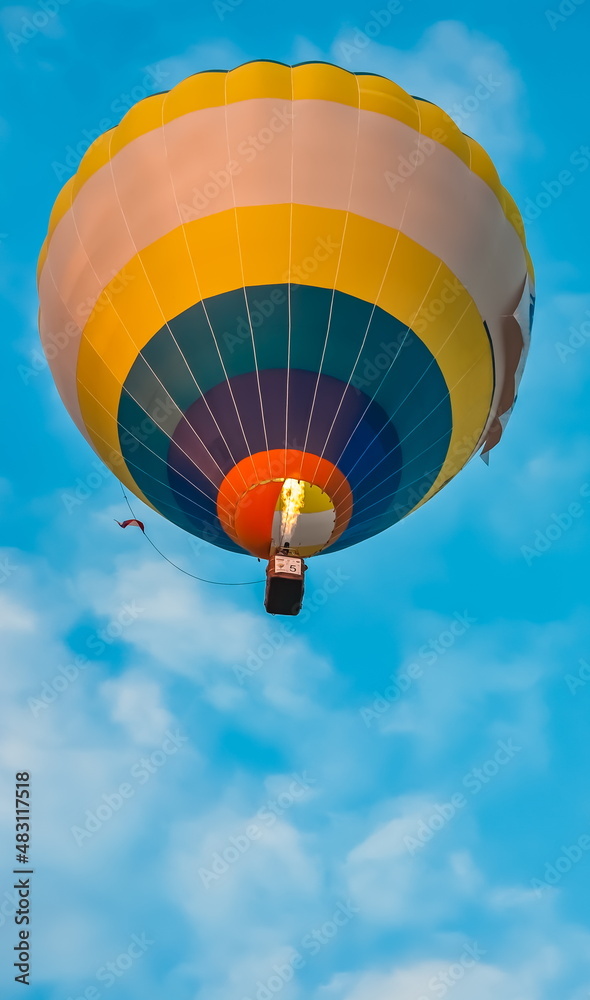 Balloon on the background of blue sky with white clouds in summer Balloon on the background of blue sky with white clouds in summer