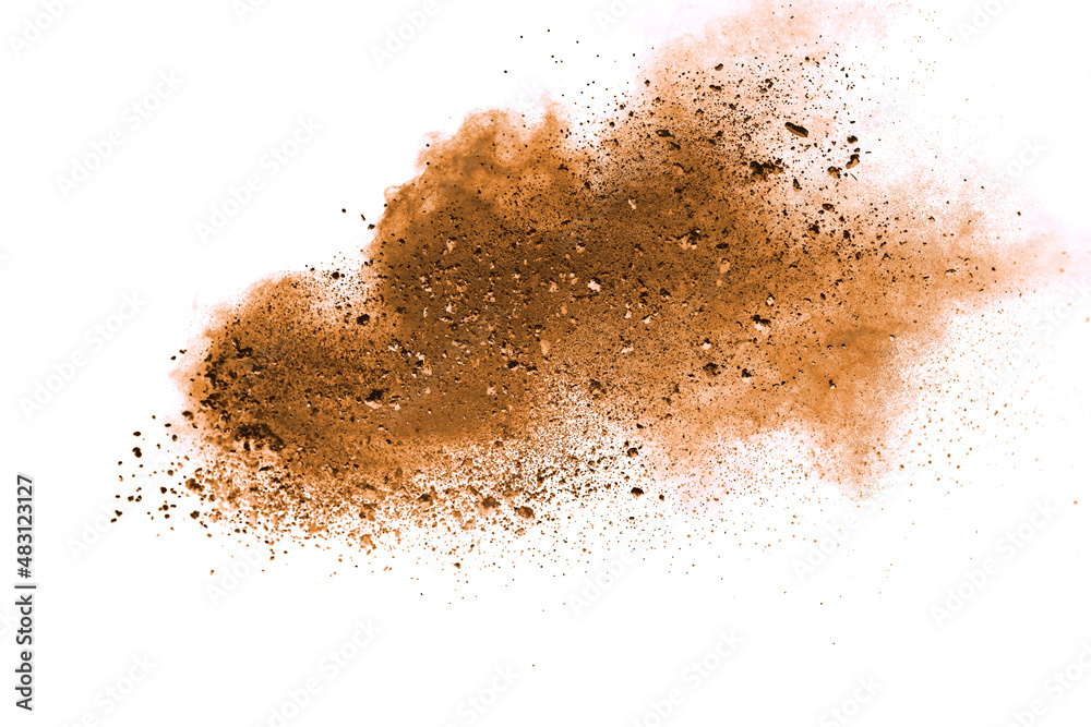 Abstract brown powder explosion. Closeup of brown dust particle splash isolated on white background Abstract brown powder explosion. Closeup of brown dust particle splash isolated on white background