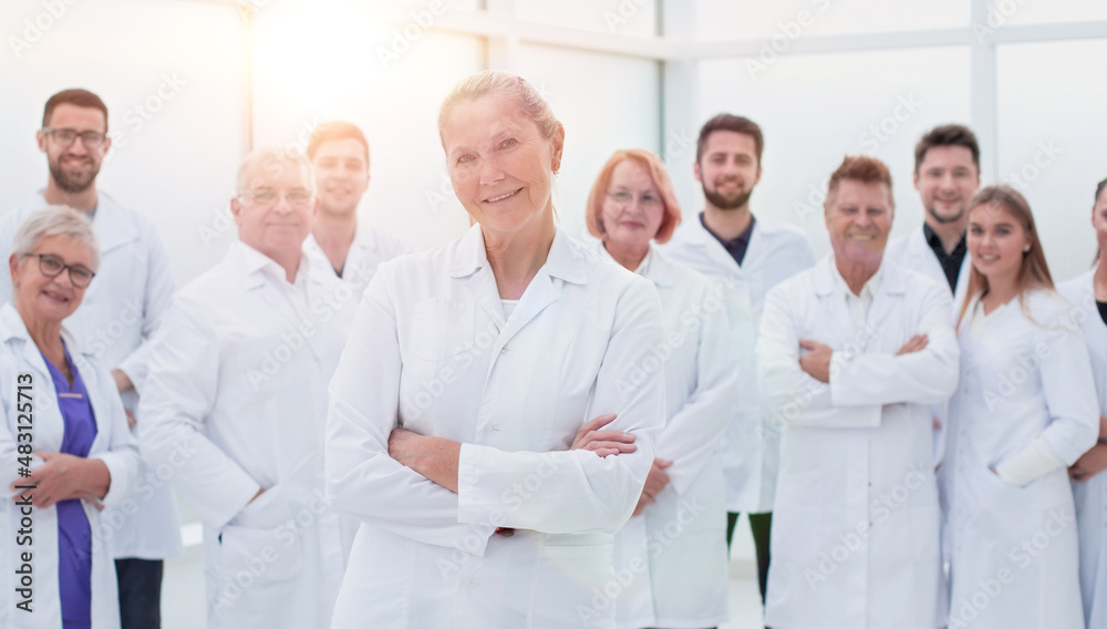 large group of people in white coats standing together. large group of people in white coats standing together.
