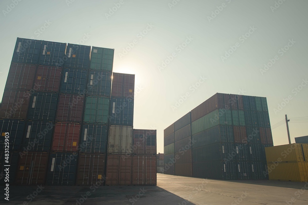 Fototapeta premium stack of containers in the port, import and export global logistics concept