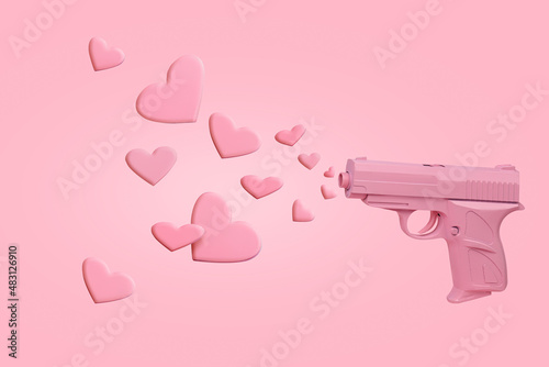 Love layout with pink pistol firing hearts on pastel pink background. Minimal Valentines Day, wedding or Mother's day event concept. Creative love romantic composition or banner with copy space. photo