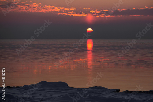 Sea landscape with sunset in winter