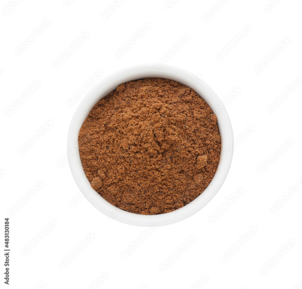 Bowl with nutmeg powder on white background, top view Bowl with nutmeg powder on white background, top view