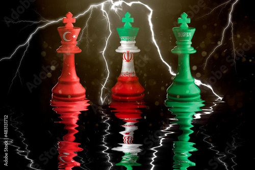 turkey, iran and saudi arabia flags paint over on chess king. 3D illustration turkey vs iran vs saudi arabia crisis. photo