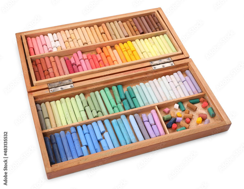 Set of soft pastels on white background in wooden box. Drawing material Set of soft pastels on white background in wooden box. Drawing material