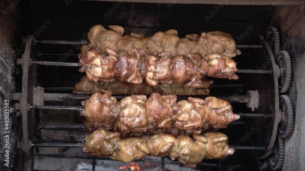 Chicken being grilled on a traditional grill Chicken being grilled on a traditional grill