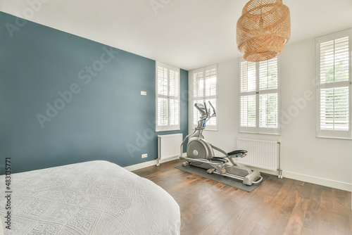 Bedroom with elliptical exercise machine