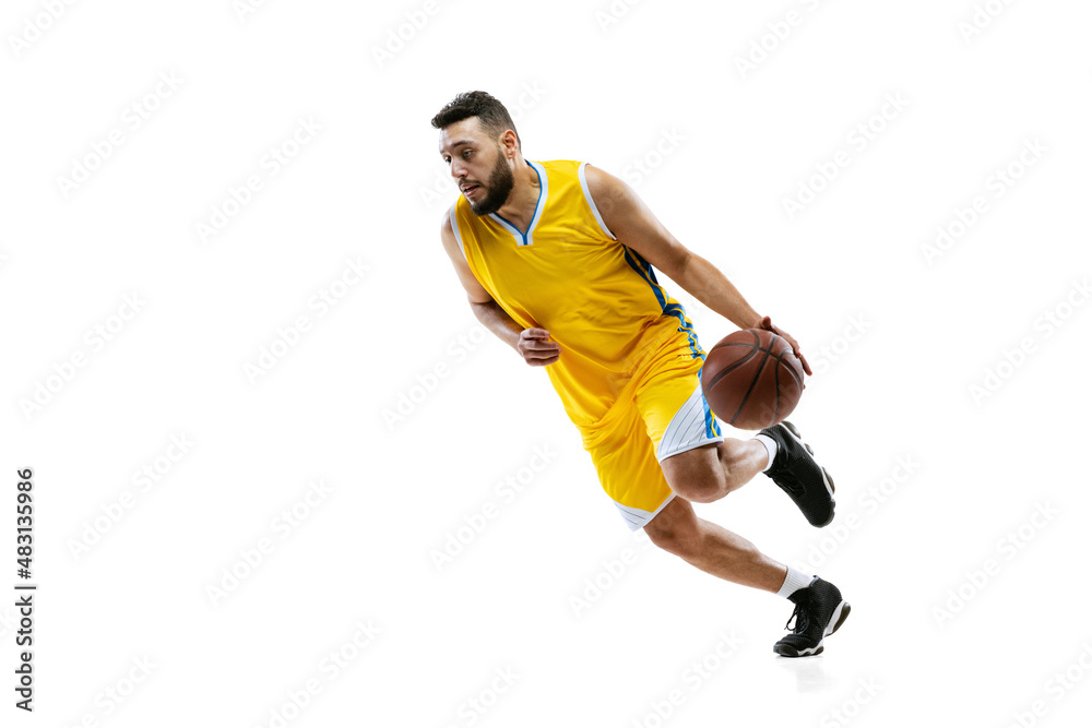 Full length portrait of professional basketball player training isolated on white studio background. Sport, motion, activity, movement concepts.