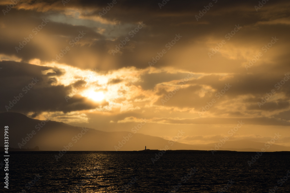 Dramatic Cloud Scape during Sunset - Oban Harbour, Argyll, Oban, Scotland - Moody silhouette image of sunset looking towards Lismore Lighthouse.