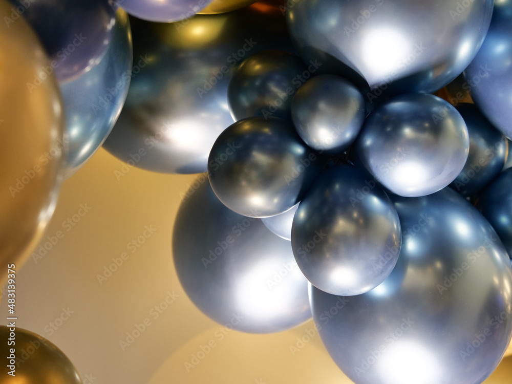 Fototapeta premium Balloons of gold and blue colors
