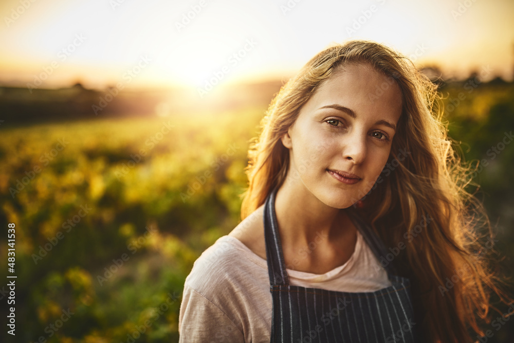 The farm life is for me. Portrait of a young woman working on a farm.