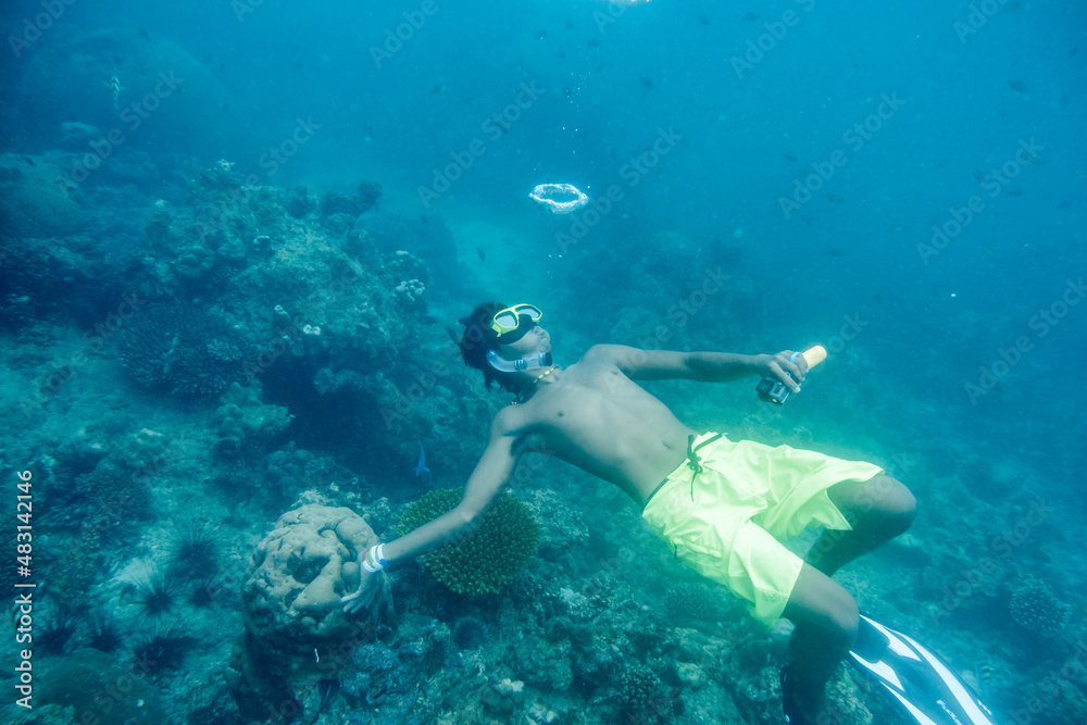Krabi, Thailand - Apr 05 2017 : Man scuba diving play bubble in ocean