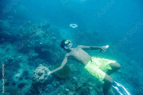 Krabi, Thailand - Apr 05 2017 : Man scuba diving play bubble in ocean