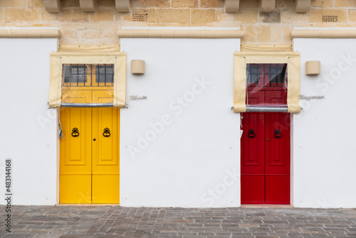 Marsaxlokk, Malta - 01 09 2022:  Two colorful doors of a facade near the port © Werner