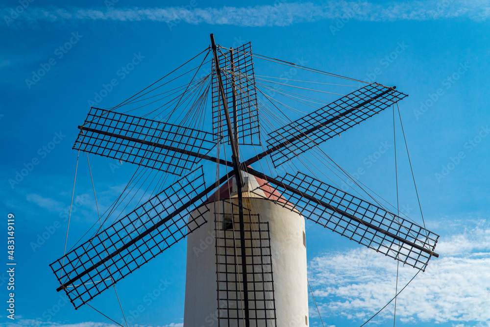 White windmill with blue sky background in Menorca (Spain). White windmill with blue sky background in Menorca (Spain).