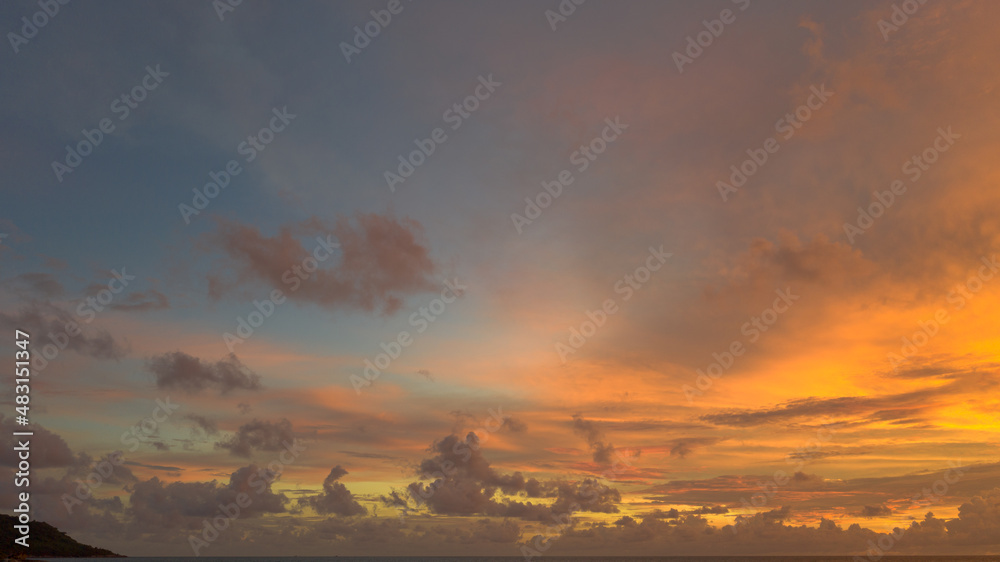 .aerial view stunning sunset above Pu island Kata beac Phuket Thailand. .Scene of colorful red light trough in the dark blue sky..Gradient color. Sky texture, abstract nature background.