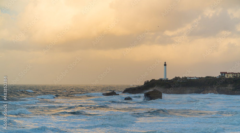 Panoramic view of Biarritz's beach and a lighthouse.