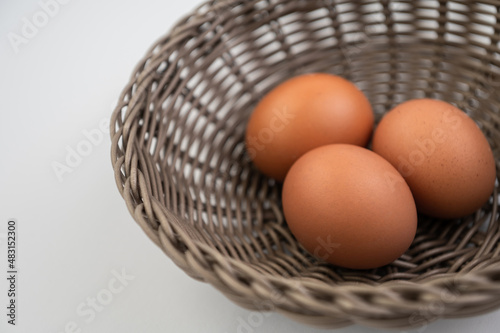 Closeup of fresh brown eggs in Easter basket