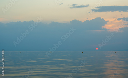 Tranquil scene of beautiful sea at sunset. Scenic seascape. Orange and yellow sunset on the sea. Aerial panoramic view of sunset over sea.