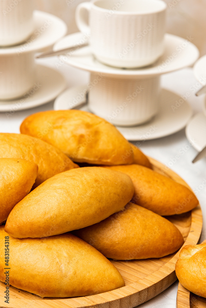 Lots of pies and buns. Hot cakes. Breakfast concept. Breakfast with buns. Lots of pies and buns. Hot cakes. Breakfast concept. Breakfast with buns.