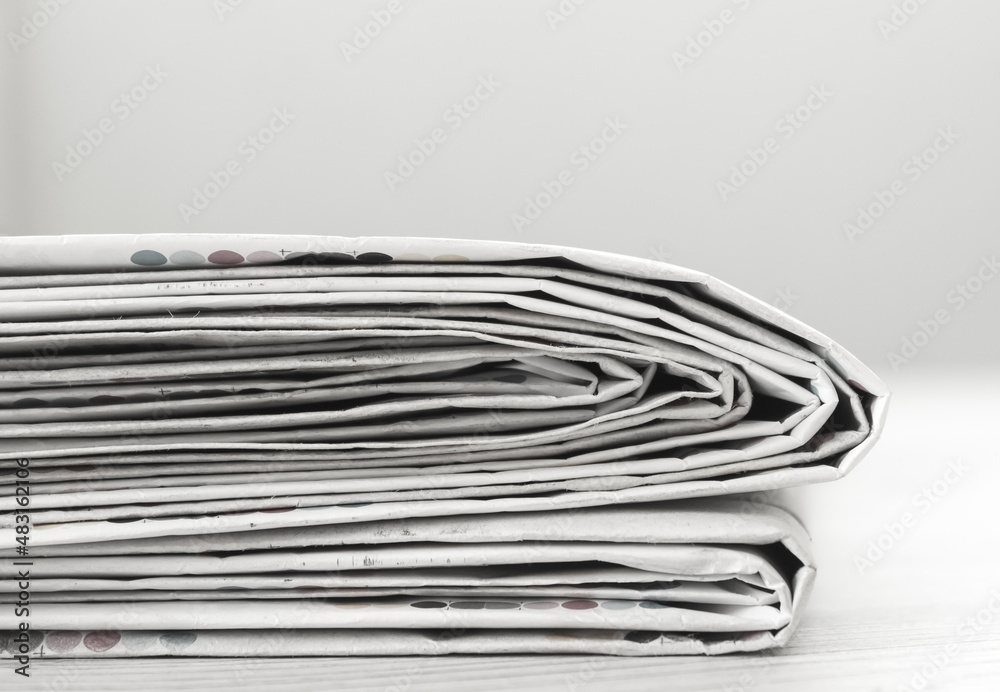 A stack of newspapers. Business news, finance. Latest information. Copy space A stack of newspapers. Business news, finance. Latest information. Copy space