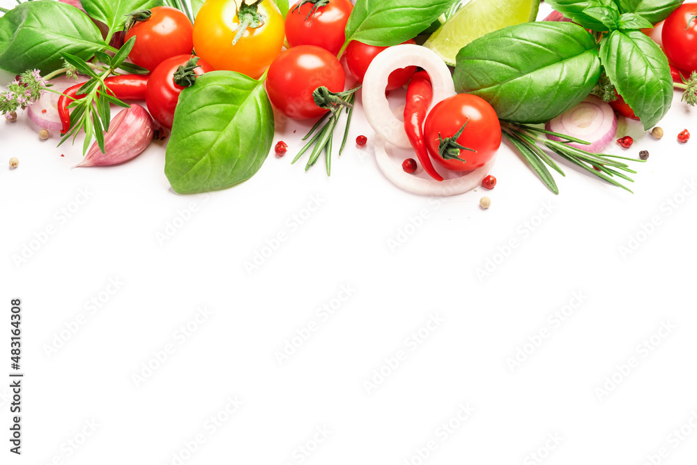 Spices, spicy herbs and vegetables. Tomato, basil, pepper, garlic, onion, thyme, lime on white background. Cooking concept, top view, copy space