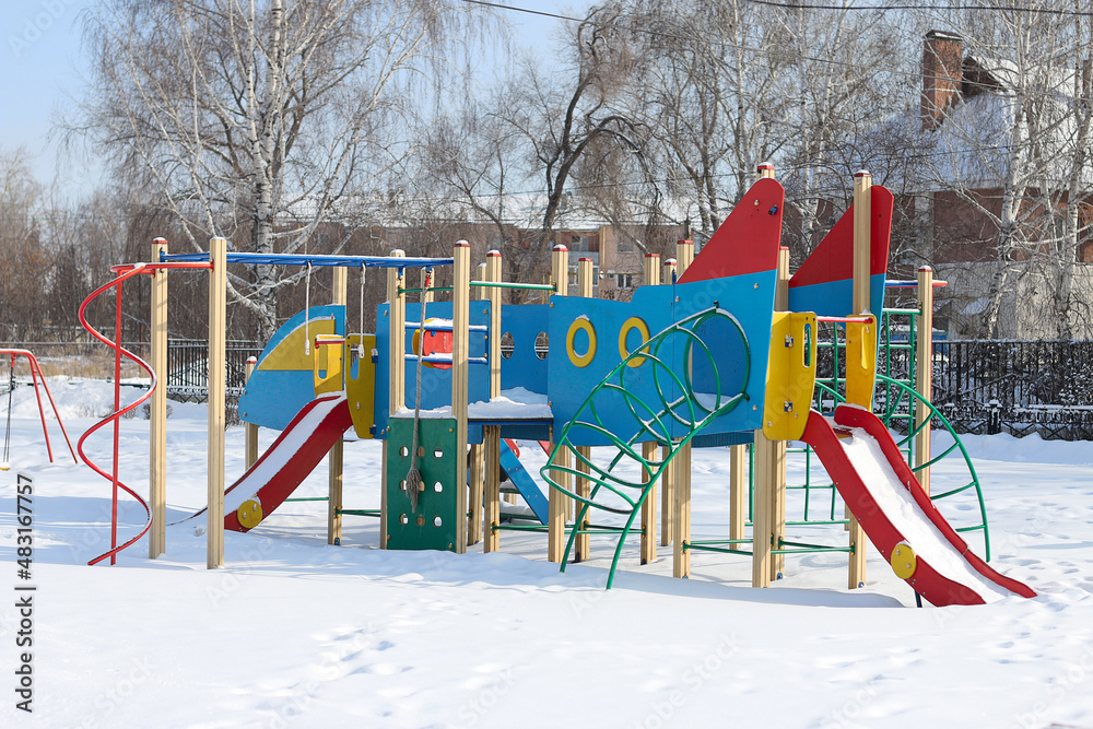 children's play complex playground with slides and stairs in the winter park children's play complex playground with slides and stairs in the winter park