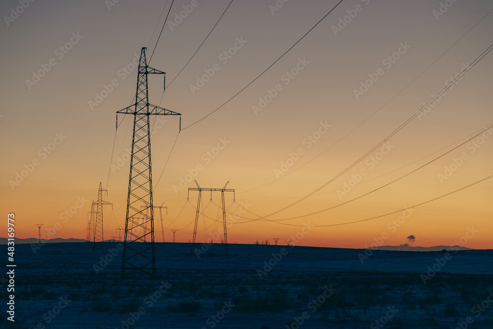 High voltage cable power in sunset