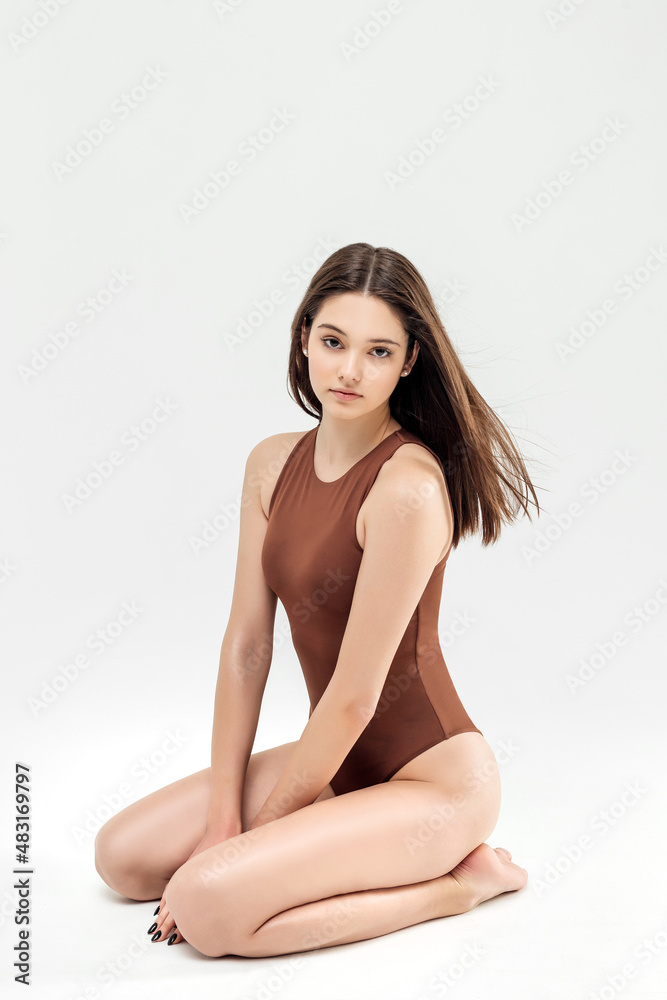 Obraz premium Perfect slim toned young body of the girl.