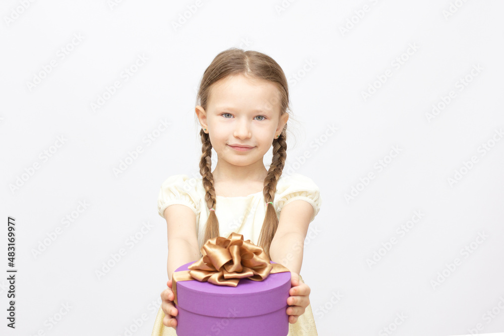 Adorable little surprise girl with purple gift box present on background Adorable little surprise girl with purple gift box present on background