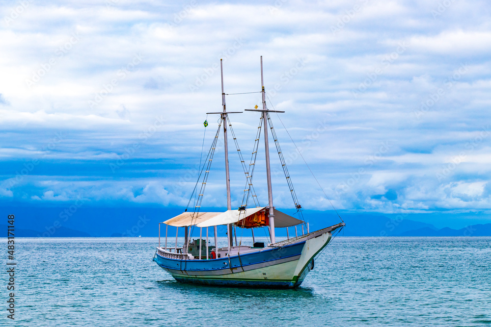 Ship sailing boats Praia de Palmas beach Ilha Grande Brazil.