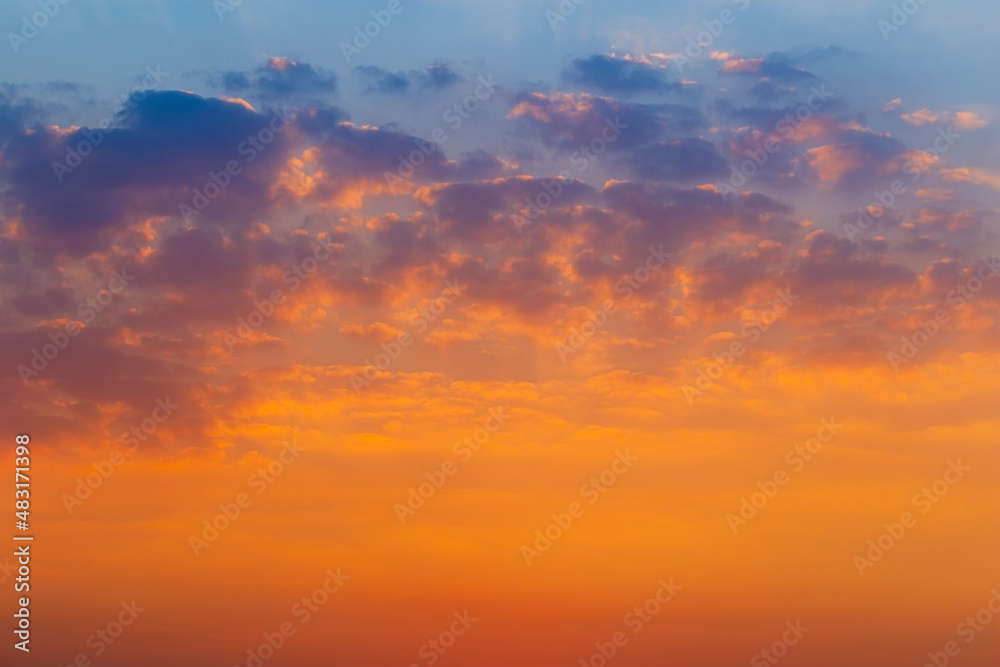 Clouds and orange sky,Panorama sunset sky background ,sunrise with clouds, light rays and other atmospheric effect