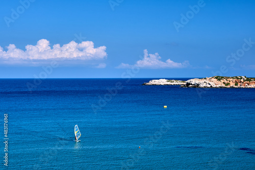 Windsurfing in a bay off the coast of Crete island,