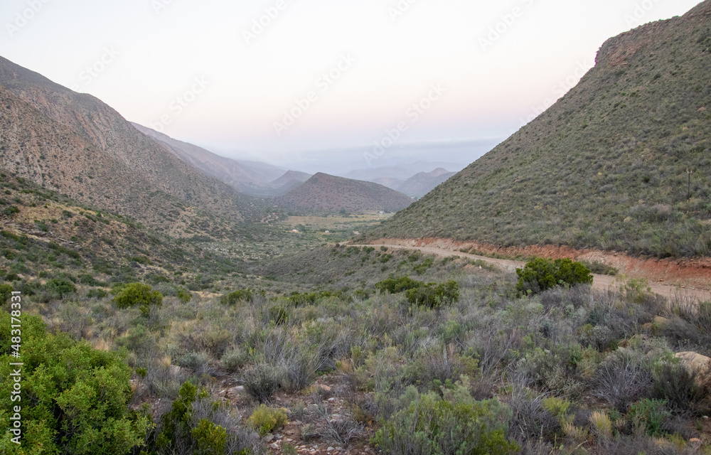 A valley of hills fade into the sunrise in Vleiland in the Central Karoo in the Western Cape province of South Africa