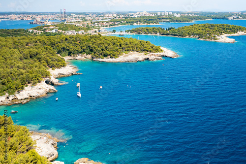 Aerial view of islands in the sea with turquoise blue water with boats and yachts in Croatia.