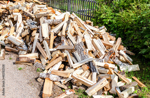 Fototapeta Naklejka Na Ścianę i Meble -  Chopped and stacked up dry firewood at the countryside