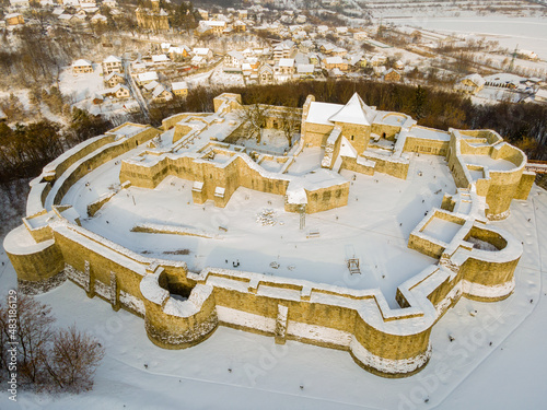Birds eye view over the medieval stronghold of Suceava. Aerial photography of the medieval fortress from Suceava, Romania shot from a drone in winter season. 