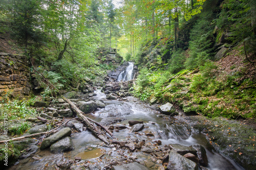 Fototapeta Naklejka Na Ścianę i Meble -  Water pouring down the Kaskady Rodła (Rodła Waterfalls) on the slopes of Mt Barania Góra, Silesian Beskids, Poland