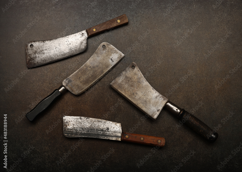 Vintage butcher meat cleavers on table