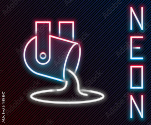 Glowing neon line Molten gold being poured icon isolated on black background. Molten metal poured from ladle. Colorful outline concept. Vector