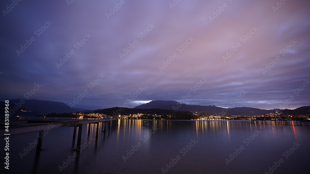 Sunset with clouds, mountains and lake Sunset with clouds, mountains and lake