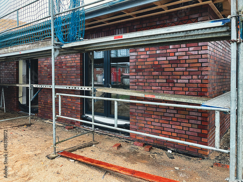 new windows were inserted into the new construction of a house photo