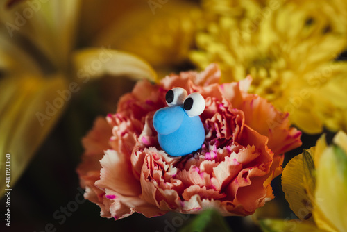 blue goober on flowers character 