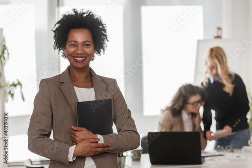 Portrait of African American Business Woman standing at Office