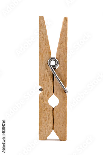 Wooden clothespin, isolated on a white background, standing upright. Close-up photo.