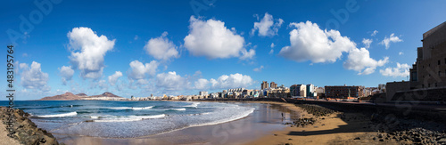 Playa de las Canteras with beautiful clouds and waves panorama photo