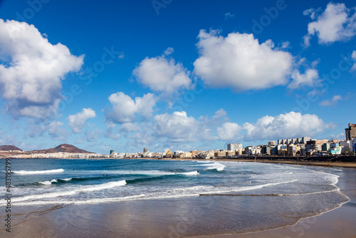 Playa de las Canteras with beautiful clouds and waves photo